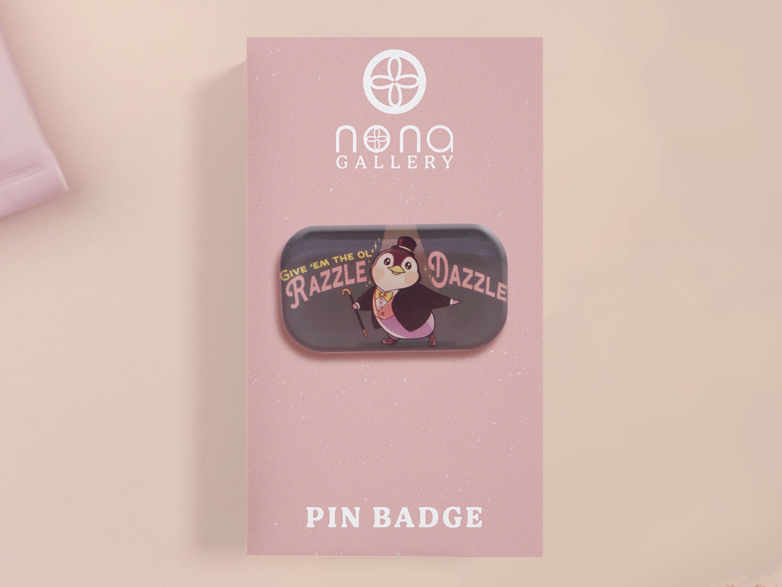 Give em The Old Razzle Dazzle Musical Penguin Meme Funny Quote Cute Acrylic Pin Badge Accessory Gift by Nona Gallery Thumbnail A clear acrylic pin badge with a pink heart-shaped pin back clasp. The design of the pin badge is of a cute chibi penguin dancing in a suit under a spotlight with the quote give 'em the ol' razzle dazzle