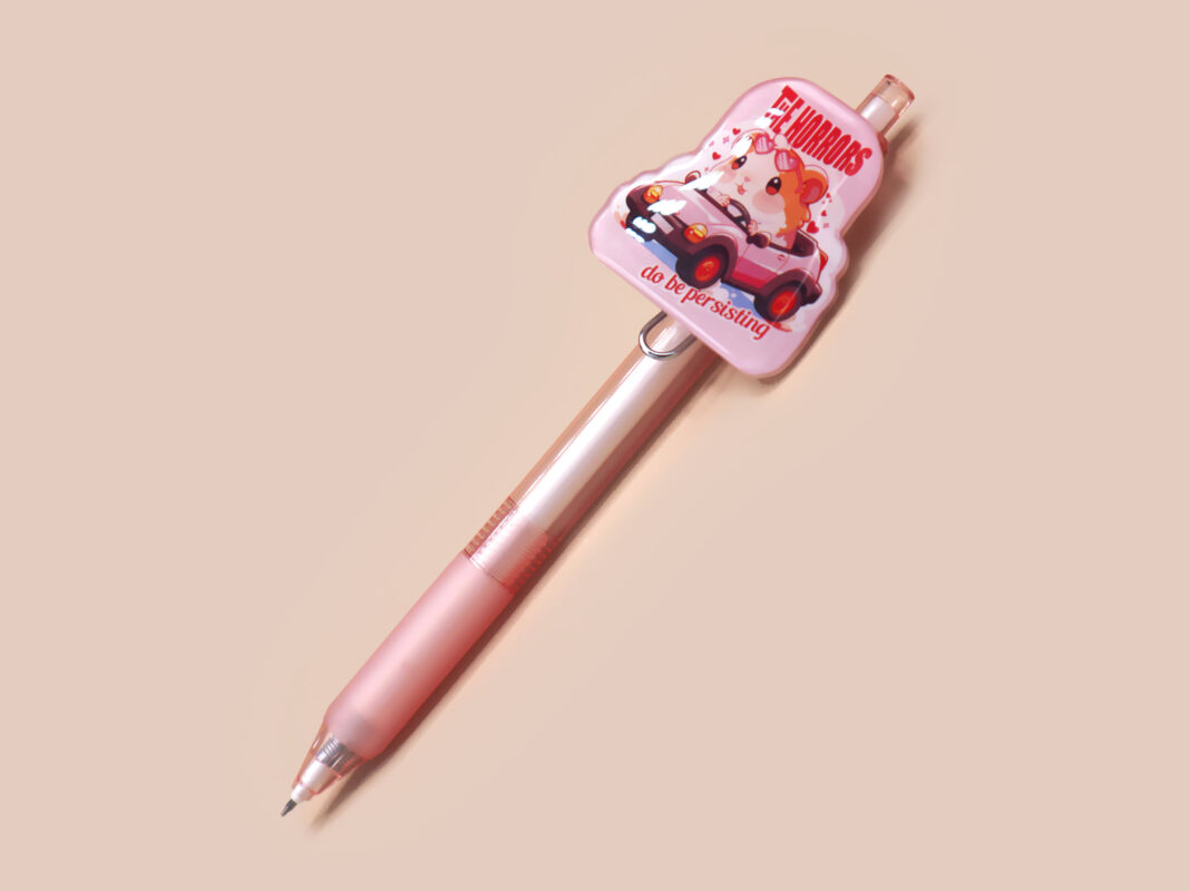 Pink ballpoint pen with black ink and a cute chibi guinea pig hamster design.