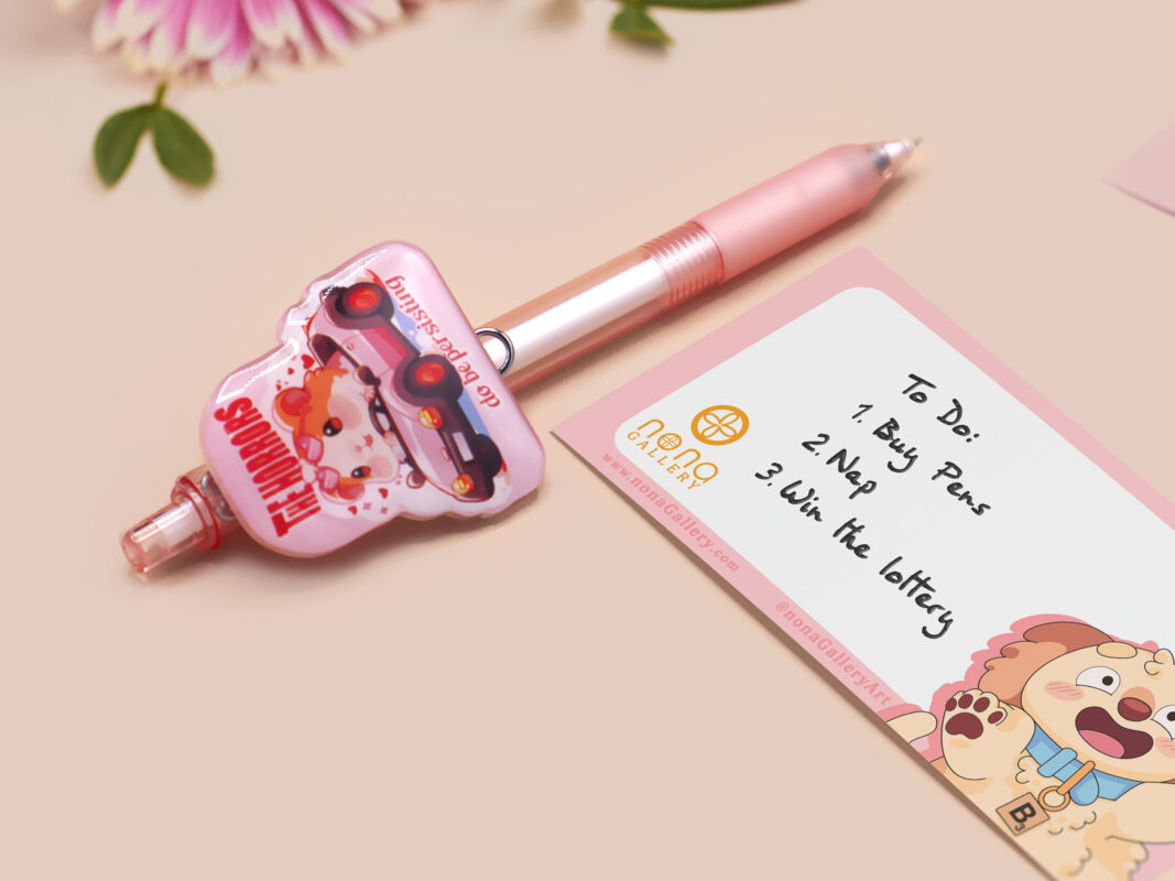 Pink ballpoint pen with black ink and a cute chibi guinea pig hamster design.
