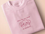 T-shirt with an embroidered Pink Design of a crying chibi hamster with the text what do you mean no dessert?!